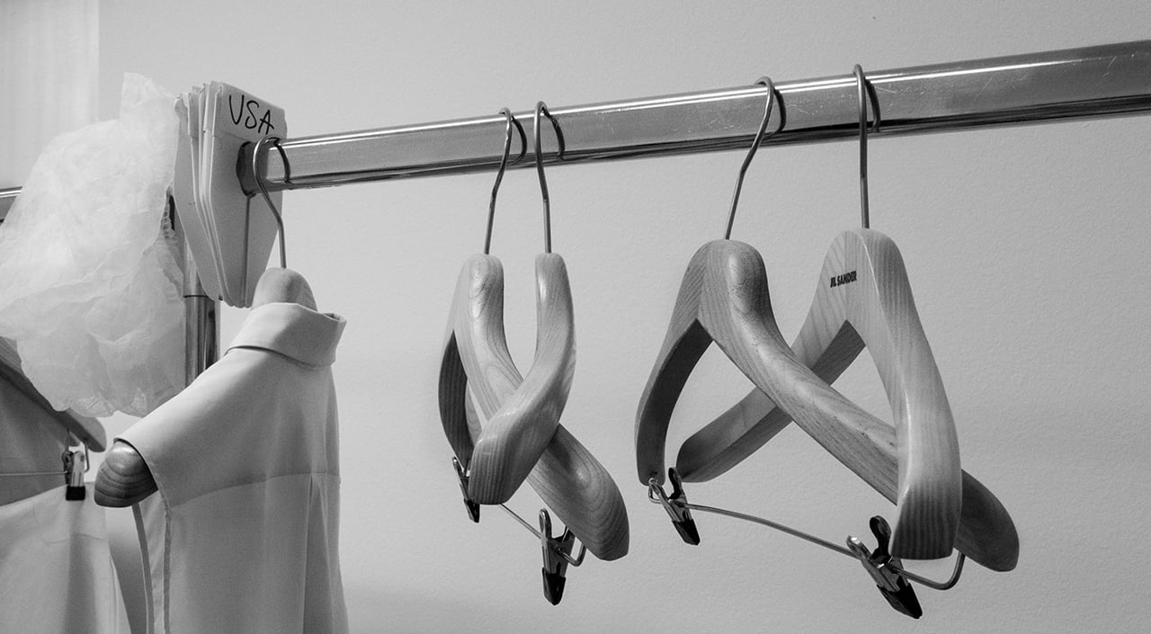 LARRY FINK'S INTIMATE DOCUMENTATION OF SALES MEETINGS AT JIL SANDER HEADQUARTERS